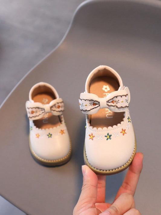 1 Par de Sapatos para Meninas com laço, sola leve e macia.