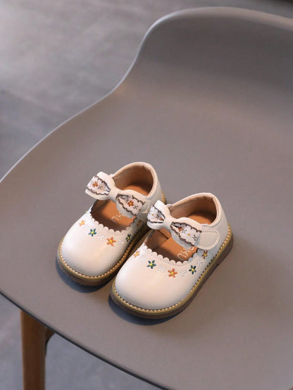 1 Par de Sapatos para Meninas com laço, sola leve e macia.