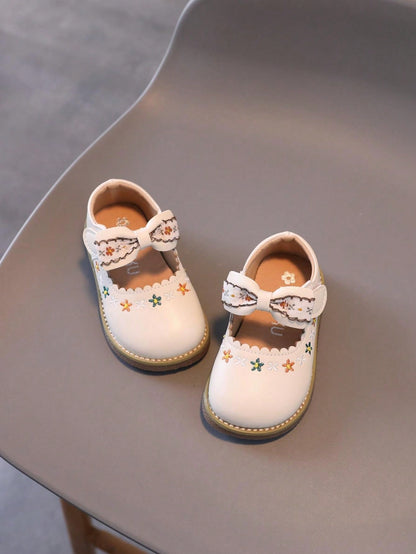 1 Par de Sapatos para Meninas com laço, sola leve e macia.